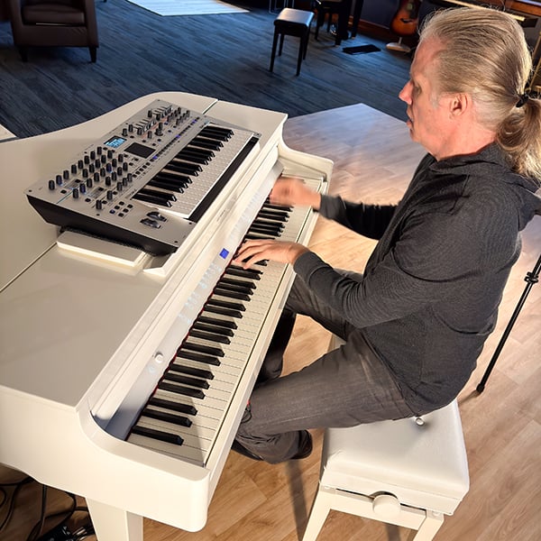 Scott Tibbs performing on a Roland digital grand piano